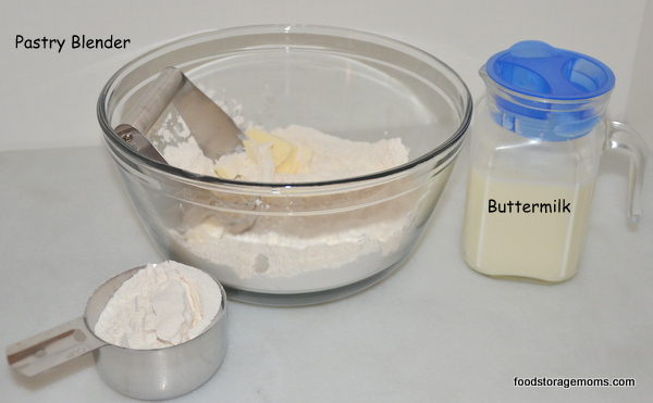 biscuit mix in a bowl with buttermilk in a container 