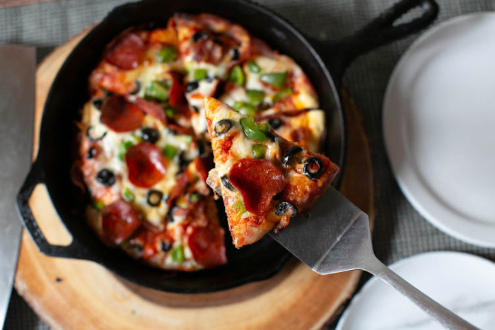 https://www.foodstoragemoms.com/wp-content/uploads/2019/07/Step-By-Step-How-To-Make-Cast-Iron-Pan-Pizza7.jpg